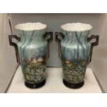 A PAIR OF TALL ORNATE TWIN HANDLED VASES WITH BIRD AND FLOWER DECORATION APPROXIMATELY 40CM TALL