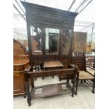 A VICTORIAN HEAVILY CARVED OAK HALL STAND WITH MIRROR-BACK AND TURNED UPRIGHTS, 44" WIDE