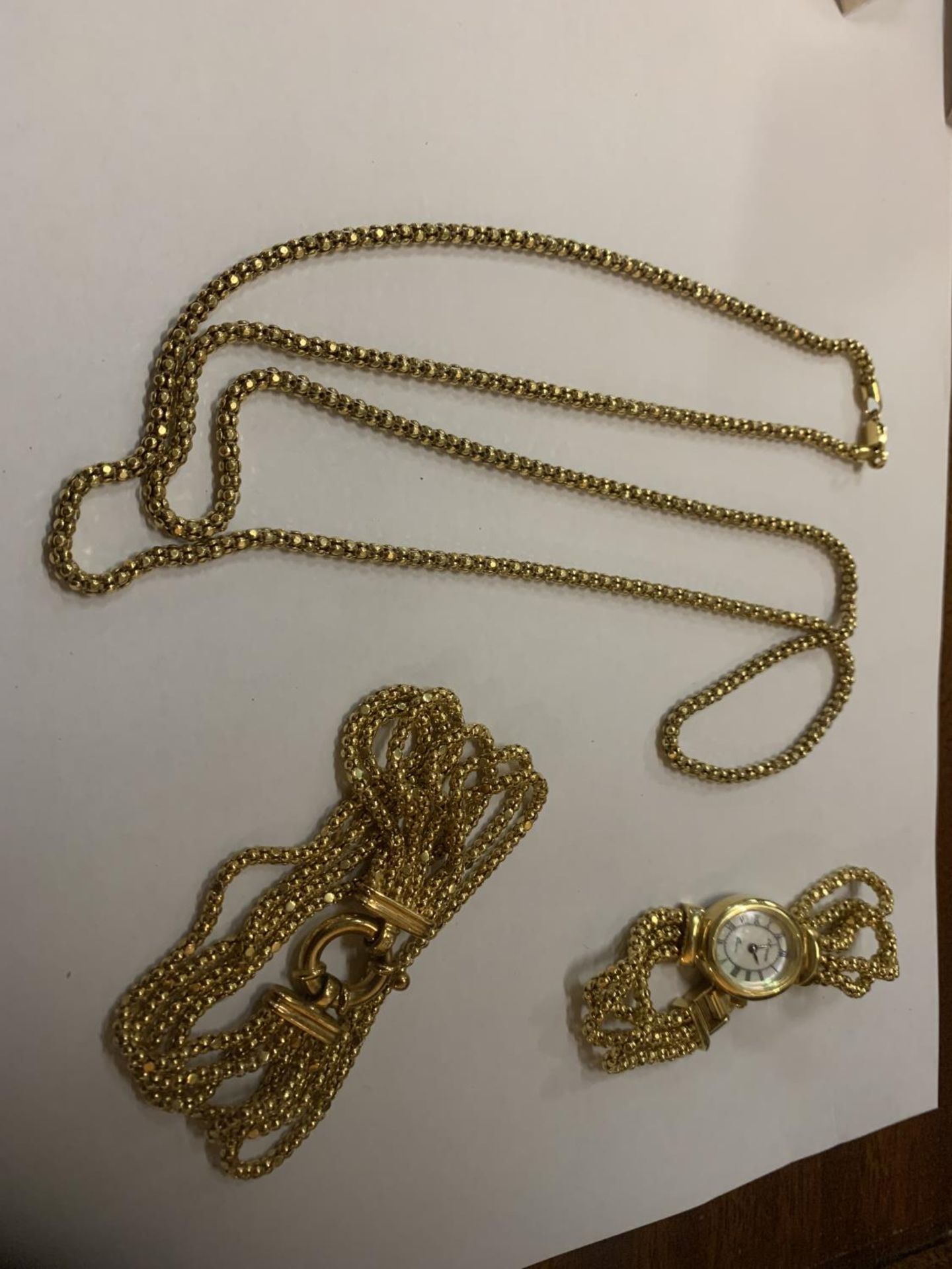 THREE SILVER GILT MARKED 925 ITEMS TO INCLUDE A NECKLACE, WATCH AND BRACELET