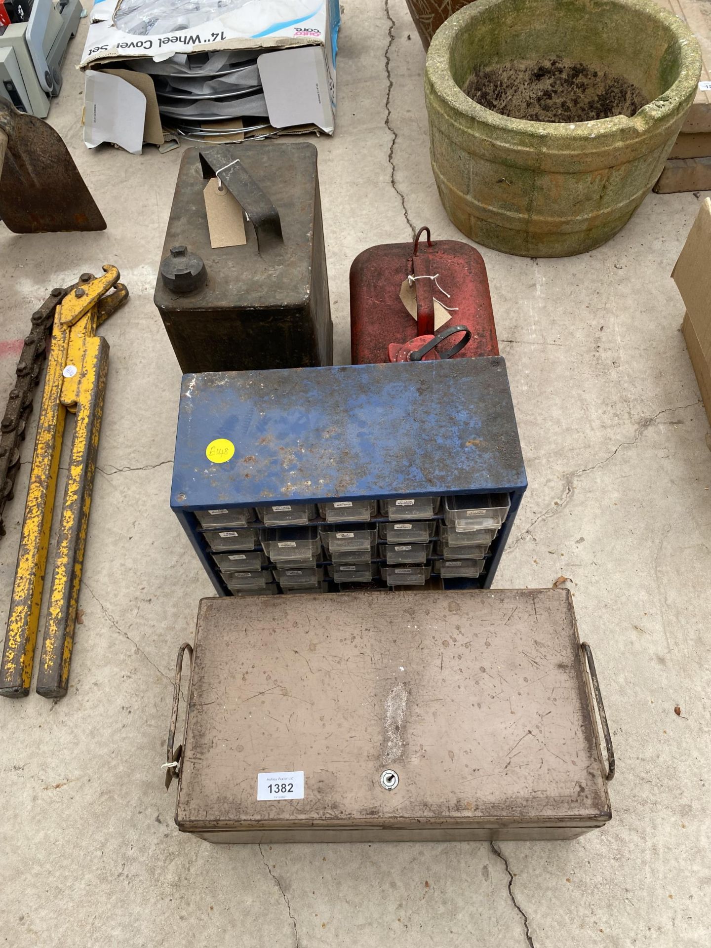 A VINTAGE FUEL CAN WITH BRASS TOP, TWO STOARGE CONTAINERS AND A FURTHER FUEL CAN