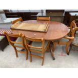 A REGENCY STYLE TWIN PEDESTAL EXTENDING DINING TABLE AND FIVE CHAIRS (ONE BEING CARVER)