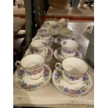 A BONE CHINA PART TEA SET COMPRISING OF SIX CUPS AND SAUCERS, SANDWICH PLATE, MILK JUG AND SUGAR