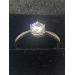 A 9 CARAT WHITE GOLD RING WITH CLEAR STONE SOLITAIRE IN A PRESENTATION BOX SIZE P/Q