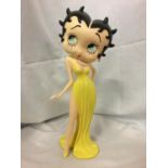 A MODEL OF BETTY BOOP IN A YELLOW DRESS