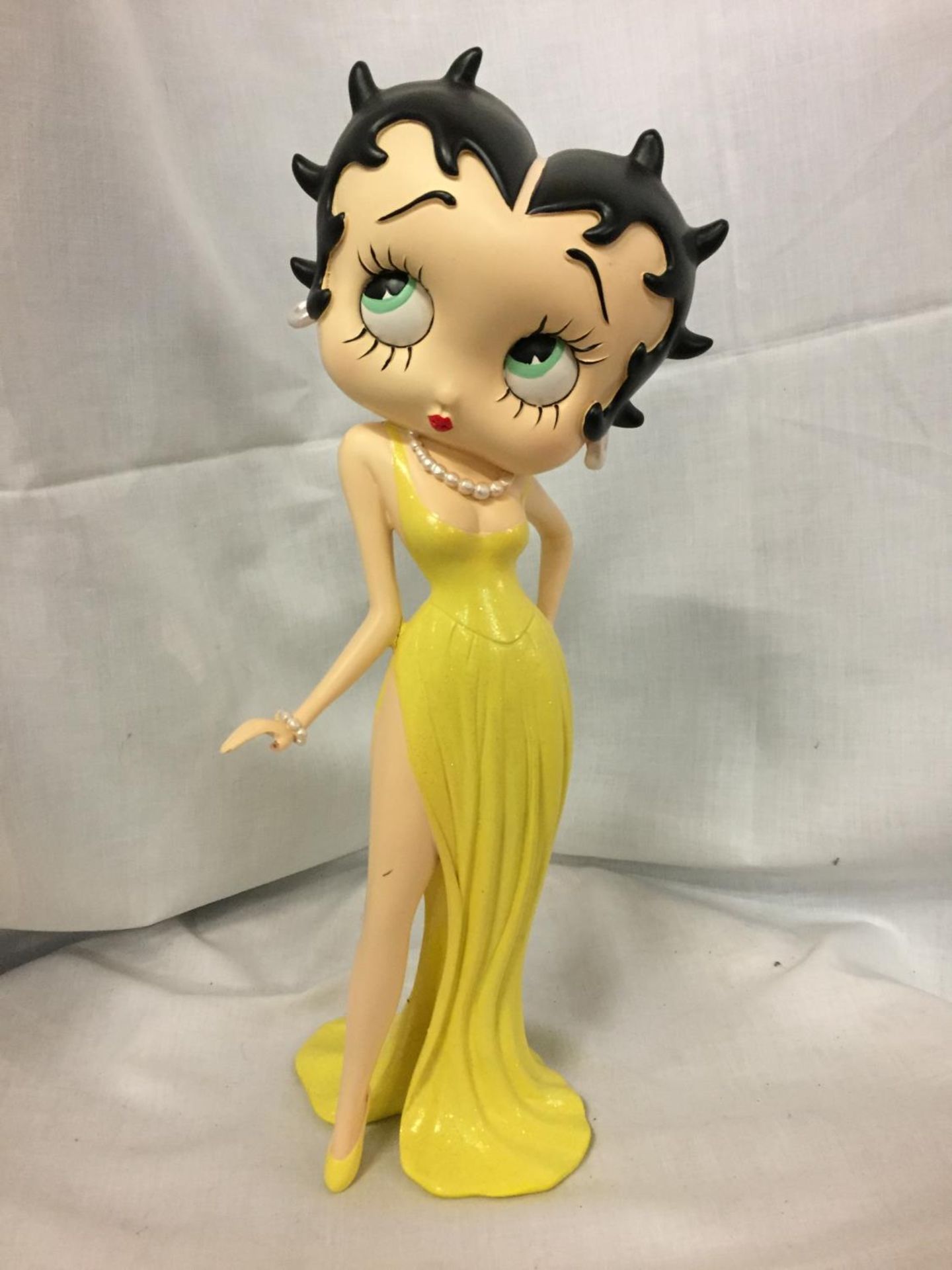 A MODEL OF BETTY BOOP IN A YELLOW DRESS