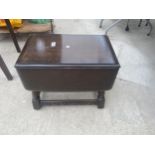 A SMALL REPRODUCTION DROP-LEAF TABLE
