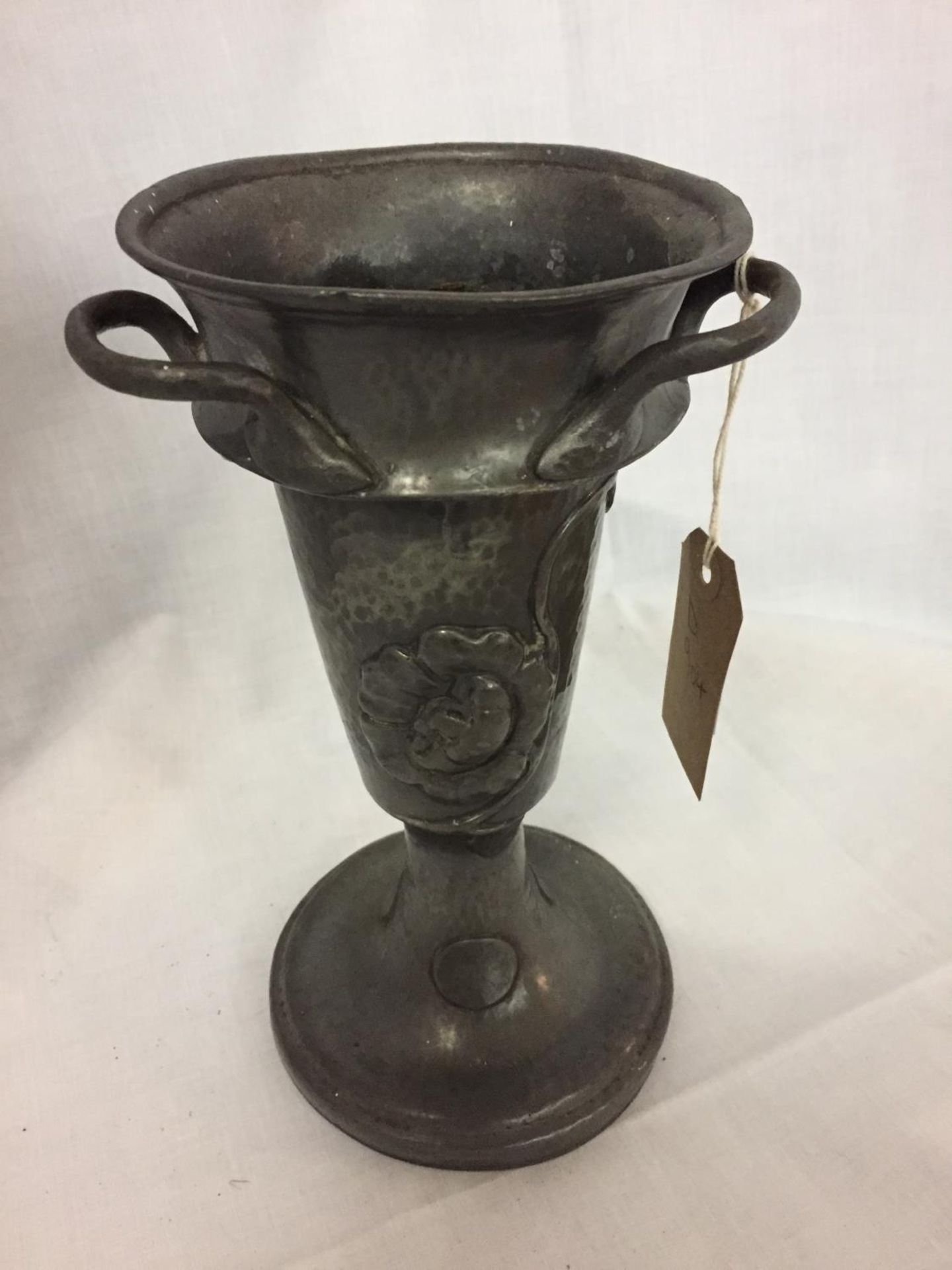 A LEADLESS PEWTER ROUNDHEAD TRI HANDLED URN