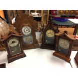 A VINTAGE AMERICAN GOTHIC STYLE CLOCK IN A WOODEN AND GLASS CASE WITH A BUTTERFLY PATTERN ON THE