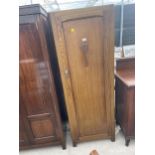 AN EARLKY 20TH CENTURY OAK HALL WARDROBE, 24" WIDE