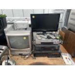 AN ASSORTMENT OF ELECTRICALS TO INCLUDE A TECHWOOD TV, LG VHS PLAYER AND SHARP VHS PLAYER ETC