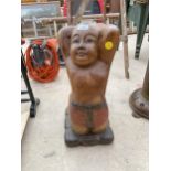 A TREEN CARVED FIGURE OF A KNEELING SUMO WRESTLER