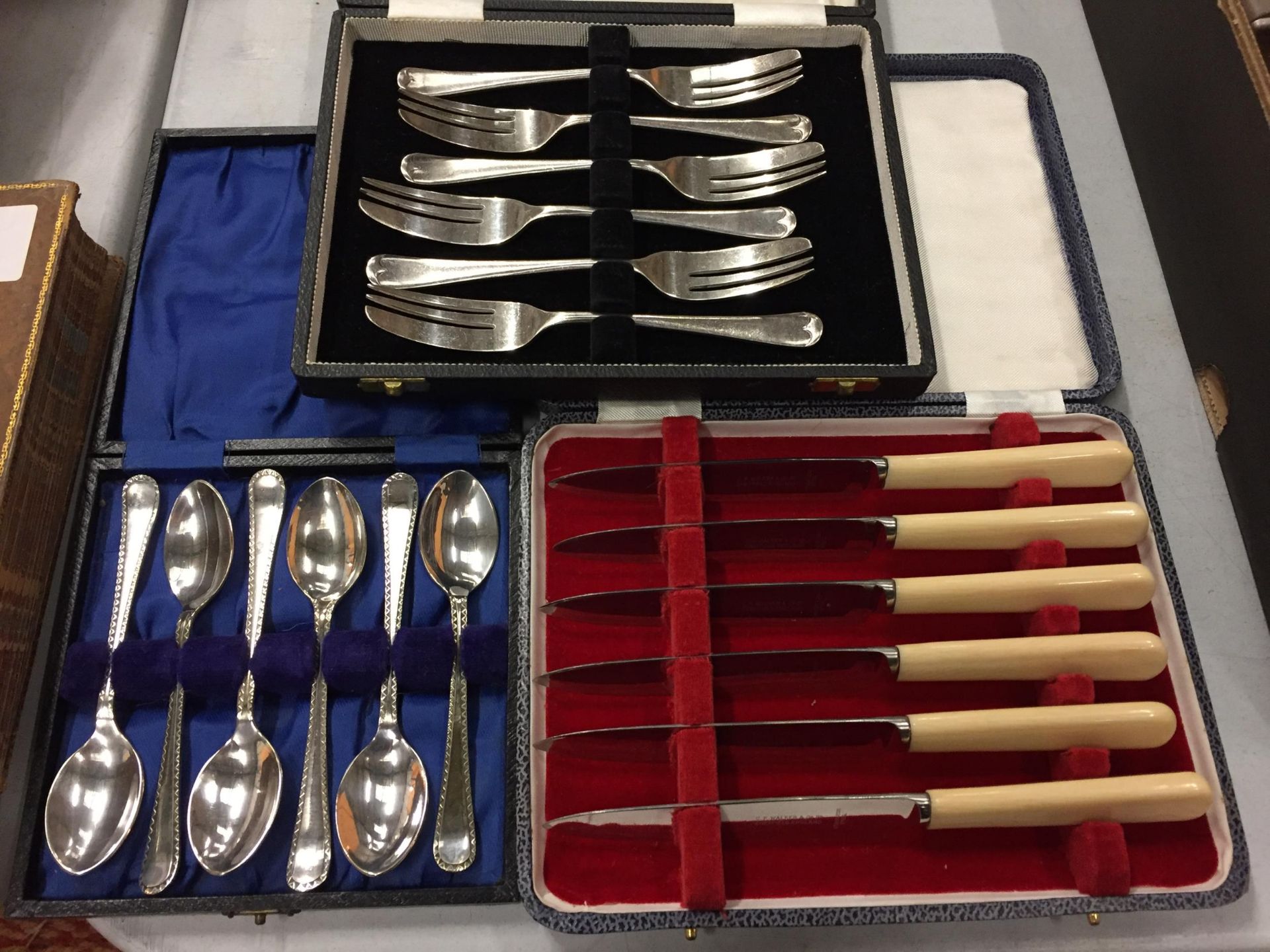 THREE BOXES OF FLATWARE TO INCLUDE KNIVES, FORKS AND TEASPOONS