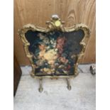 A DECORATIVE PEERART GILT AND FLORAL FIRE SCREEN (ONE SUPPORT NEEDS REATTACHING)