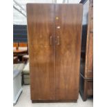 A SHINY WALNUT COMBINATION WARDROBE