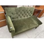 A 20TH CENTURY BUTTON BACK DROP-END SETTEE