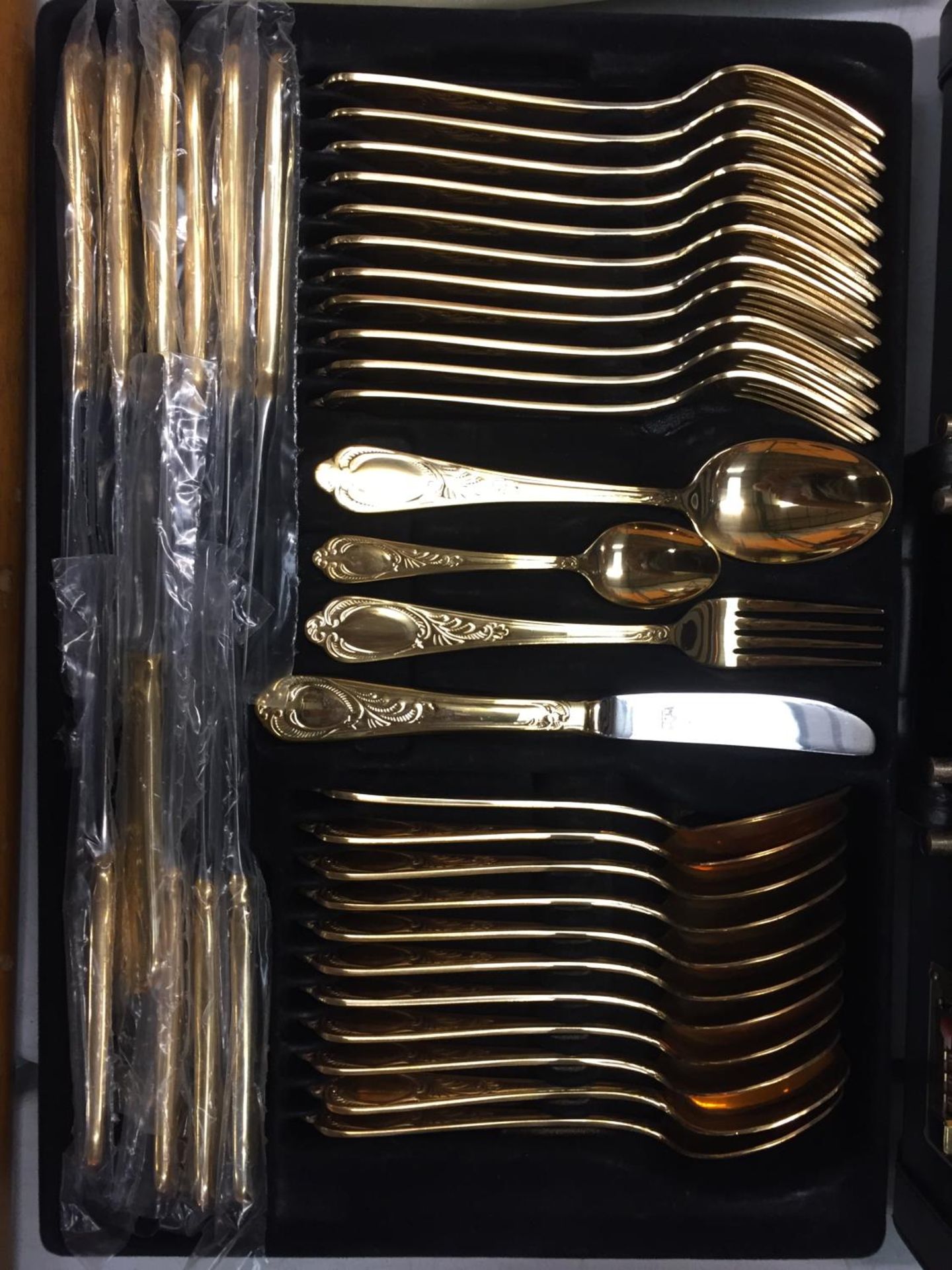 A TWELVE SETTING GOLD PLATED CANTEEN OF CUTLERY WITH SERVING SPOONS,LADELS, CAKE FORKS ETC IN A CASE - Image 2 of 5