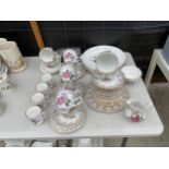 AN ASSORTMENT OF CERAMIC ITEMS TO INCLUDE FLORAL TRIOS AND A SHIP IN A BOTTLE ETC