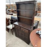 A REPRODUCTION OAK DRESSER COMPLETE WITH RACK, 37" WIDE