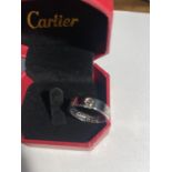 A FASHION 'LOVE' RING BOXED AND IN A BAG SIZE P; 4.10GRAMS