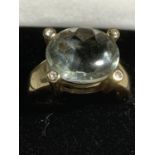 A 9 CARAT GOLD RING WITH LARGE LIGHT GREEN STONE SIZE N/O GROSS WEIGHT 5.5 GRAMS
