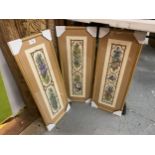 A SET OF THREE FRAMED FLORAL PRINTS