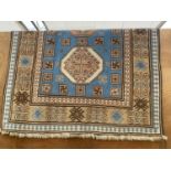 A KAZAX STYLE FRINGED PATTERNED RUG