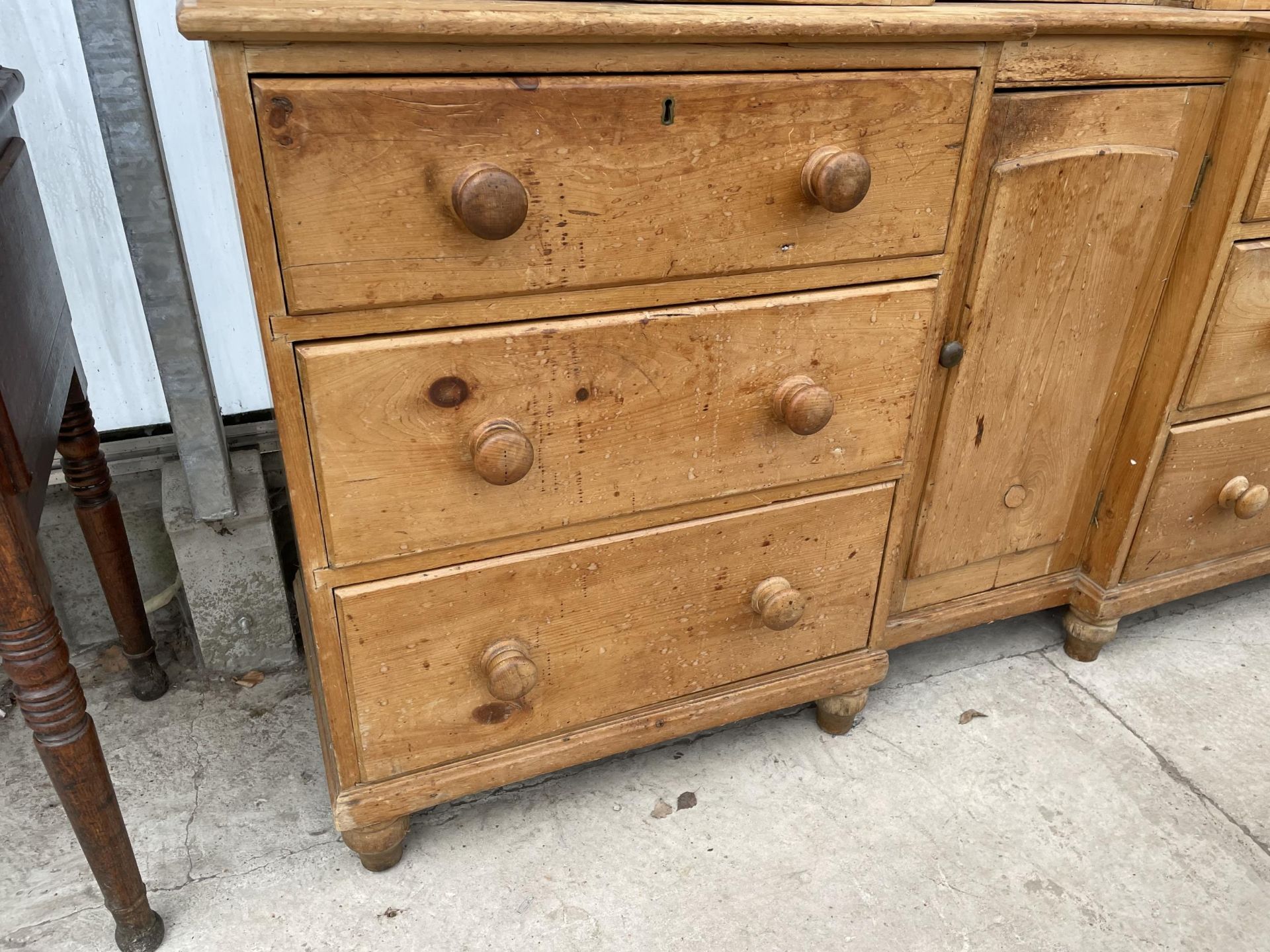 A VICTORIAN PINE INVERTED BREAKFRONT HOUSEKEEPERS CUPBOARD WITH SIX DRAWERS AND CUPBOARD TO THE - Image 6 of 9