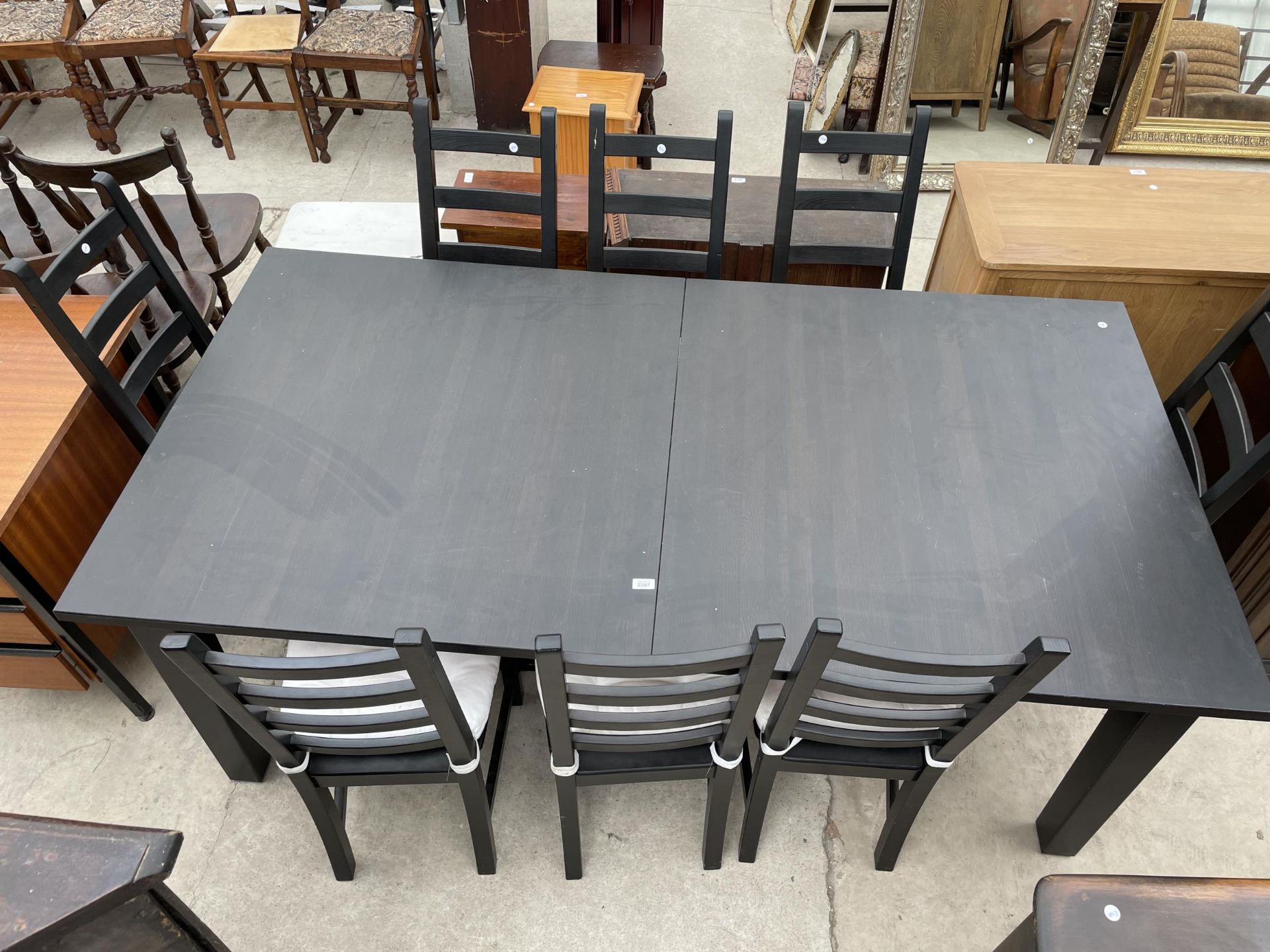 A MODERN KAUSTBY BLACK DINING TABLE, 80 X 42", COMPLETE WITH TWO LEAVES, 18" WIDE AND EIGHT