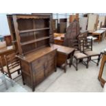 A REPRODUCTION OAK JACOBEAN STYLE DRESSER WITH PLATE RACK, GATELEG DINING TABLE AND FOUR
