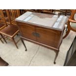 A MAHOGANY COCKTAIL CABINET ON CABRIOLE LEGS, 30" WIDE