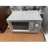 A SILVER DAEWOO MICROWAVE OVEN