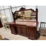 A VICTORIAN MAHOGANY BREAKFRONT SIDEBOARD WITH MIRROR-BACK, THE BASE ENCLOSING FOUR CUPBOARDS AND