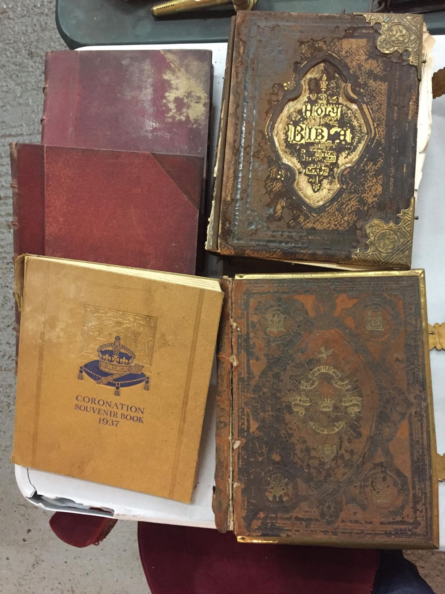 A COLLECTION OF FIVE BOOKS TO INCLUDE TWO LARGE BRASS BOUND OLD LEATHER BIBLES, VOLUMES 1 & 2 OF
