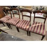 A SET OF FOUR REGENCY MAHOGANY DINING CHAIRS ON TURNED AND FLUTED LEGS