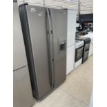A SILVER SAMSUNG AMERICAN STYLE FRIDGE FREEZER WITH WATER DISPENSER