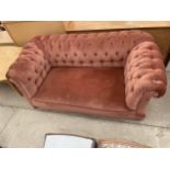 AN EDWARDIAN CHESTERFIELD DROP-END SETTEE