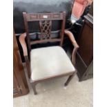 A 19TH CENTURY STYLE ELBOW CHAIR