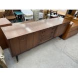 A G-PLAN E-GOMME RETRO TEAK SIDEBOARD WITH THREE DRAWERS AND TWO BI-FOLD DOORS - 75" WIDE