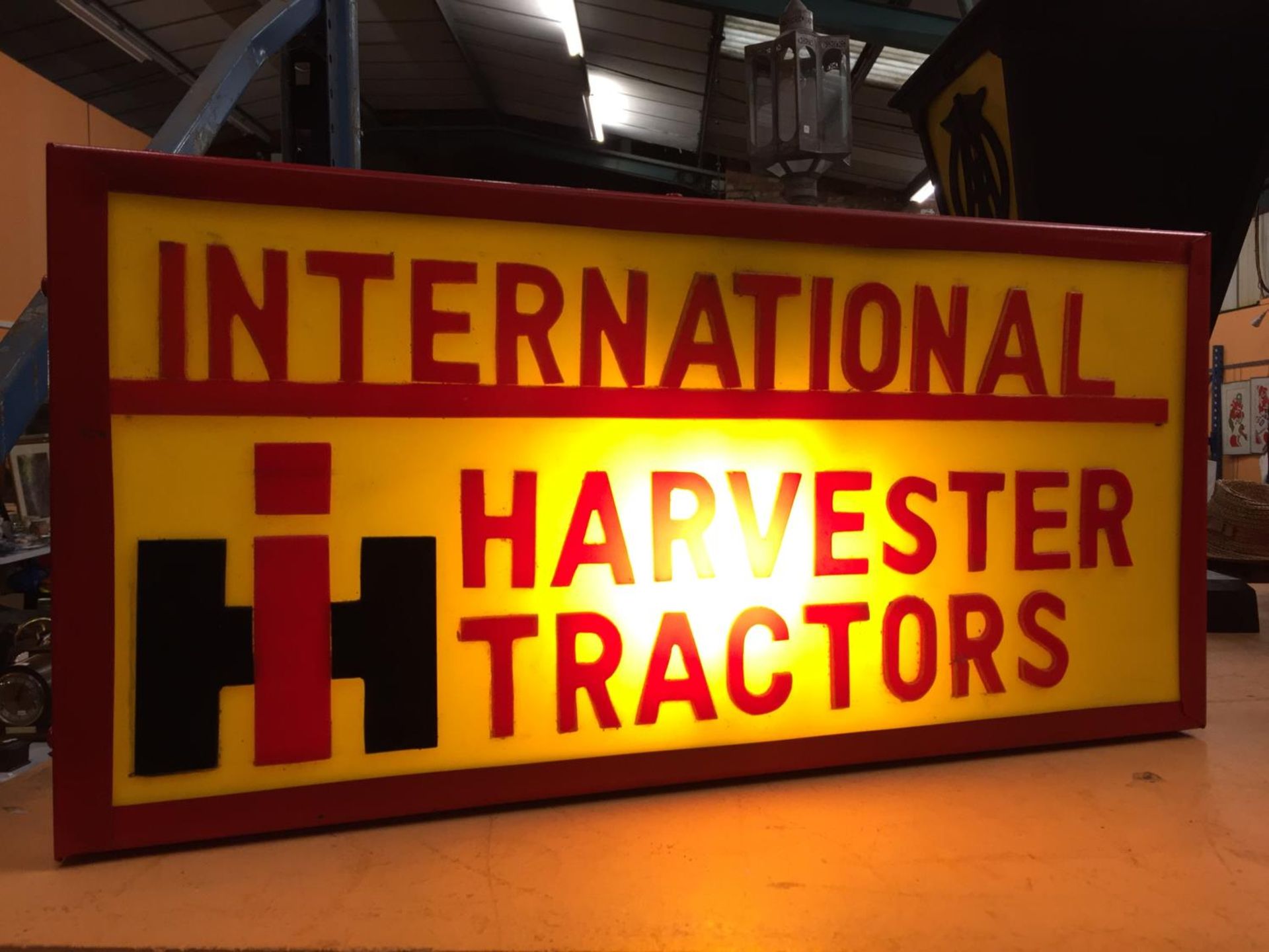 AN INTERNATIONAL HARVESTER TRACTORS ILLUMINATED LIGHT BOX SIGN