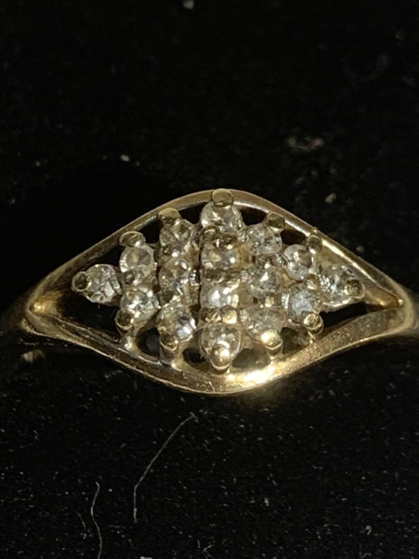 A 9 CARAT GOLD RING WITH SMALL CLEAR STONES IN A DIAMOND DESIGN SIZE N GROSS WEIGHT 2.3 GRAMS