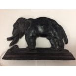 A CAST IRON ELEPHANT DOORSTOP SIZE 10 CM HIGH