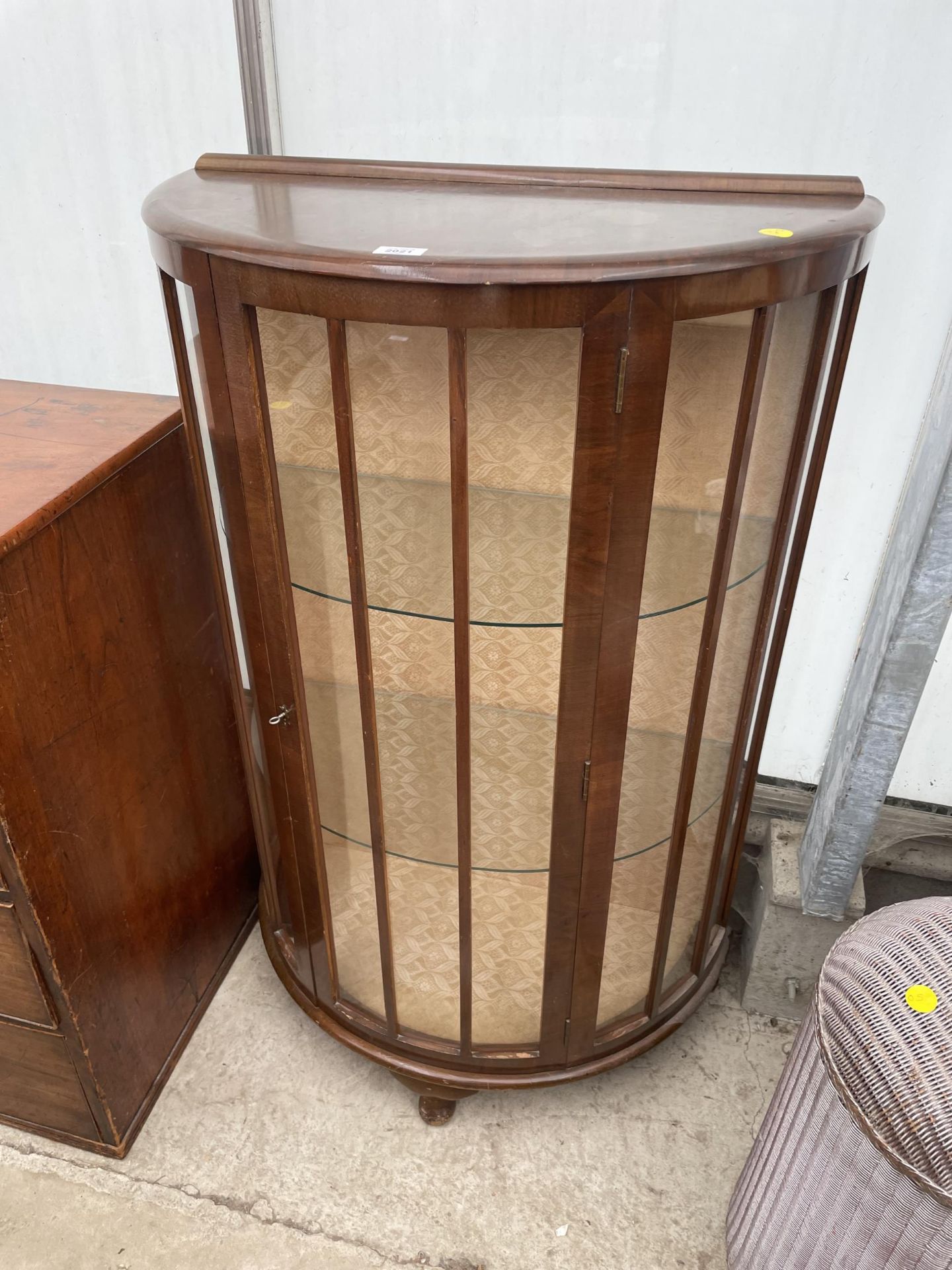 A SHINY WALNUT BOWFRONTED CHINA CABINET ON CABRIIOLE LEGS, 30" WIDE