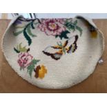 AN OVAL TAPESTRY RUG