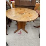 A MODERN PINE KITCHEN TABLE, 39" DIAMETER