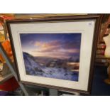 A SIGNED FRAMED PRINT OF A SNOWY MOUNTAIN SCENE