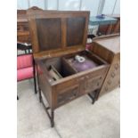 AN EARLY 20TH CENTURY OAK WIND-UP GRAMOPHONE CABINET ON BARLEYTWIST LEGS (THE ALTONA, MAGNUM)