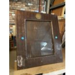 AN ARTS AND CRAFTS PHOTOGRAPH FRAME APPROXIMATELY 33CM X 36CM