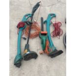 A GROUP OF ELECTRIC GARDEN TOOLS TO INCLUDE THREE GRASS STRIMMERS AND A HEDGE CUTTER