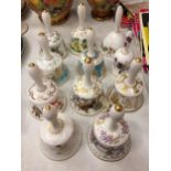 A COLLECTION OF ELEVEN DECORATIVE CERAMIC HAND BELLS