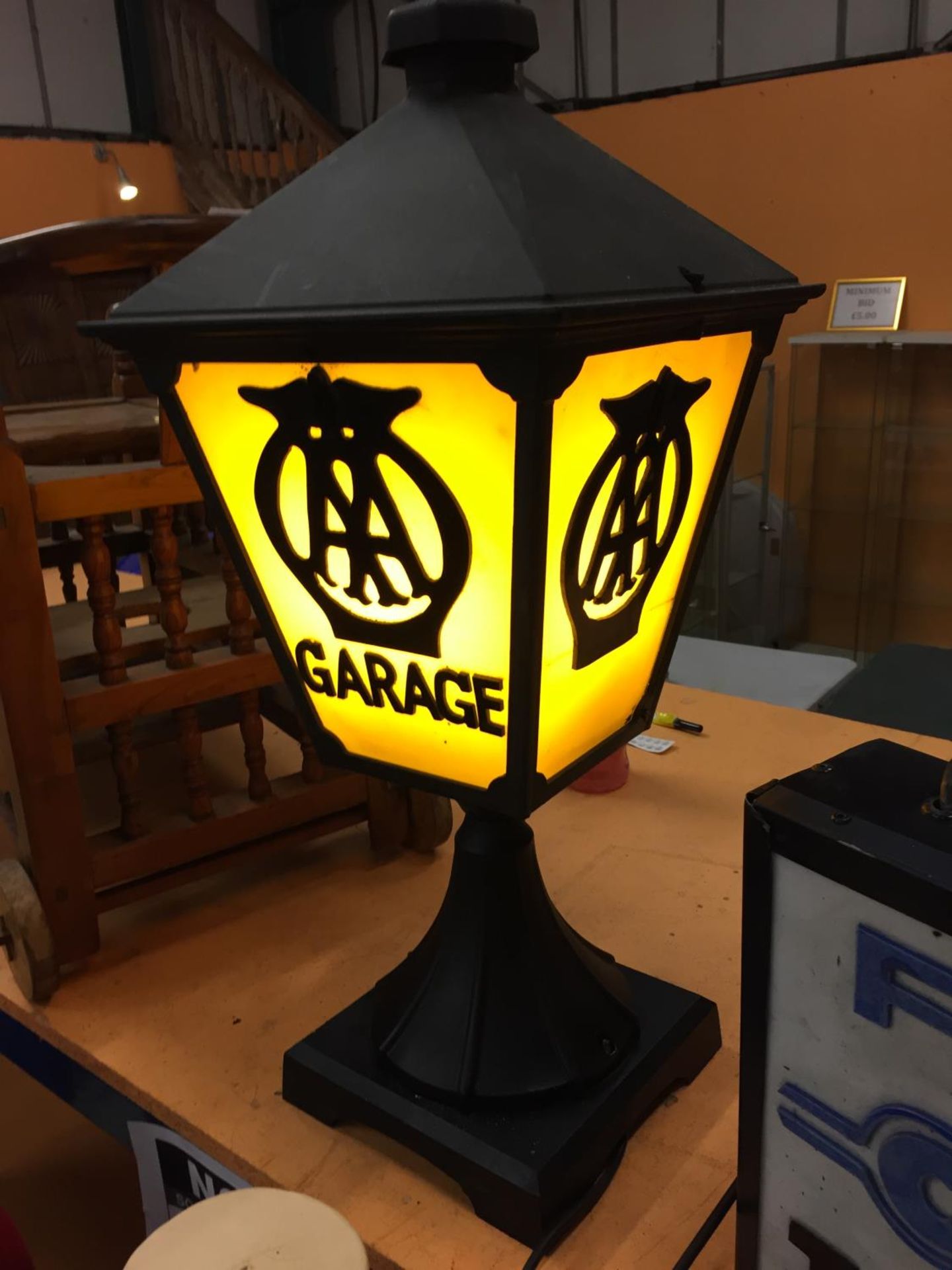 A CAST METAL LAMP WITH AA GARAGE THREE SIDED DETAIL TO PANELS AND BELIEVED IN WORKING ORDER BUT NO - Image 3 of 4